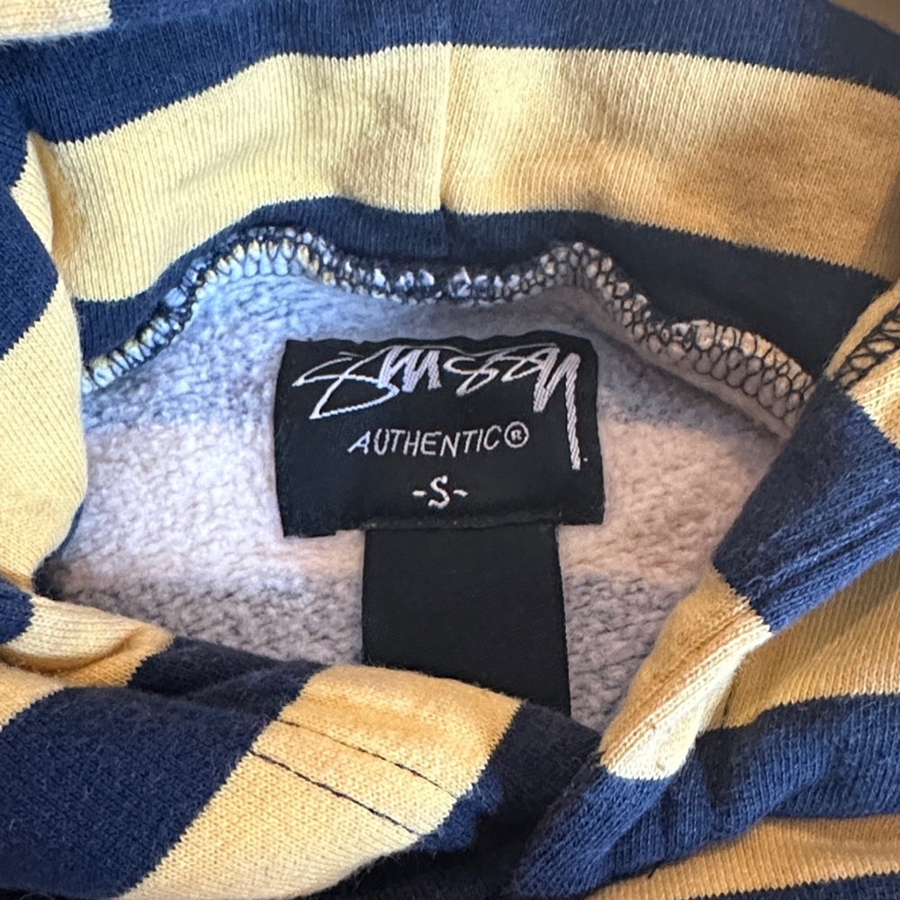 Stussy Men's Bold Navy and Gold Striped Hoodie. No pockets.